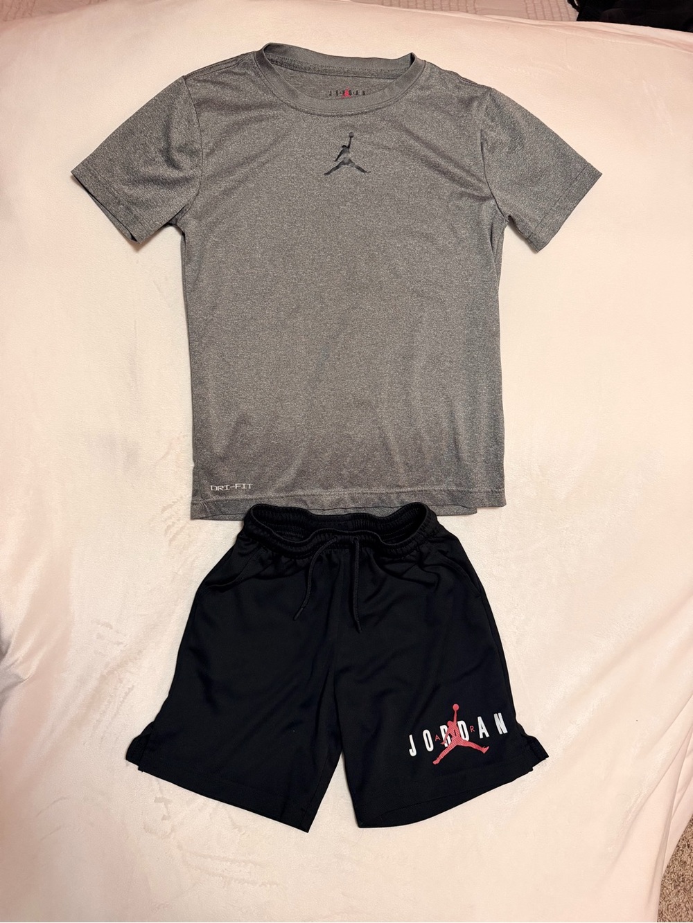 Jordan Black Athletic Shorts with Red Jumpman Logo with matching grey tee shirt.